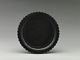 Dish with chrysanthemum-petal rim, Black lacquer with traces of gold decoration, China