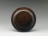 Dish with chrysanthemum-petal rim, Black lacquer with traces of gold decoration, China