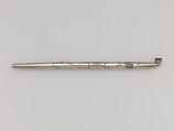 Tobacco Pouch and Pipe with Netsuke of Freshwater Pearl in Gold Mount, Pouch: Dutch embossed leather with silver foil, and color
Clasp: gold, shakudō and shibuichi
Ojime: gold
Netsuke: freshwater pearl and gold
Pipe: metal
Pipe case: Dutch embossed leather with silver foils, and color, Japan