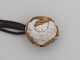 Tobacco Pouch and Pipe with Netsuke of Freshwater Pearl in Gold Mount, Pouch: Dutch embossed leather with silver foil, and color
Clasp: gold, shakudō and shibuichi
Ojime: gold
Netsuke: freshwater pearl and gold
Pipe: metal
Pipe case: Dutch embossed leather with silver foils, and color, Japan