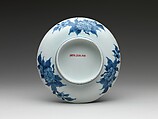 Dish with Cherry Blossoms and Textile Curtains, Porcelain with celadon glaze, partial brown glaze, and underglaze blue decoration (Hizen ware, Nabeshima type) , Japan