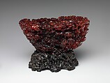 Ornament with landscape and figures, Amber, China