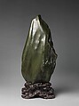 Soaring Peak, Sea-green hornblende with yellow markings; carved wood stand, China