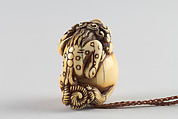 Netsuke in the Shape of a Lion with a Ball, Ivory, Japan