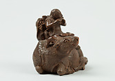 Netsuke of Man Playing Flute atop an Ox, Wood, Japan