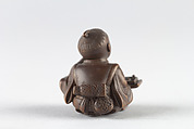 Netsuke of Young Boy at Writing Desk, Dreaming, Wood, Japan