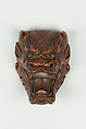 Netsuke of Devil Mask with Wide-Open Mouth, Wood, dark brown; inlaid green glass eyes, Japan