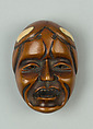 Netsuke of Woman's Face, Wood; ivory inlay to represent hair, Japan