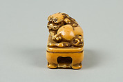 Netsuke of Lion on a Stand, Ivory, Japan