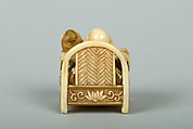 Netsuke of Hotei Seated in an Armchair, Ivory ornamented with lacquer, Japan