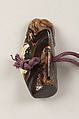Inrō with the Noh Play Ebira (Quiver), Three cases; lacquered wood with gold, silver, color takamaki-e, hiramaki-e on red ground
Netsuke: fossilized wood
Ojime: carved red lacquer bead, Japan