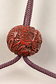 Inrō with the Noh Play Ebira (Quiver), Three cases; lacquered wood with gold, silver, color takamaki-e, hiramaki-e on red ground
Netsuke: fossilized wood
Ojime: carved red lacquer bead, Japan