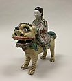 Figure of Bodhisattva Guanyin riding a lion, Porcelain painted in polychrome enamels over the biscuit (Jingdezhen ware), China