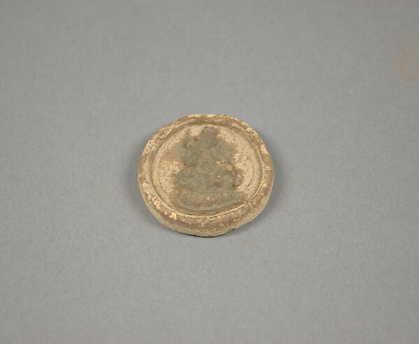 Votive Plaque with Seated Figure