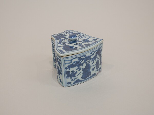 Covered box with figures in garden