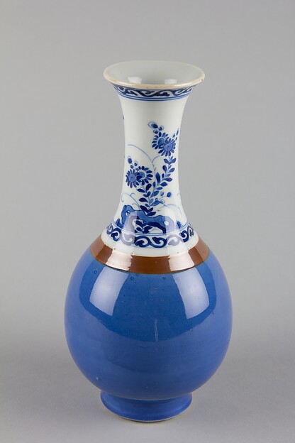 Vase with flowers and rocks