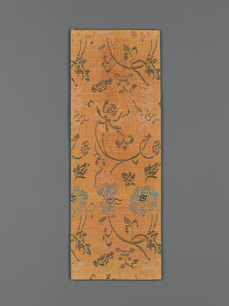 Sutra cover with boys holding the stems of large flowers