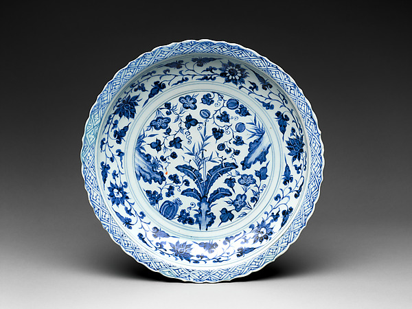 Foliated plate with rocks, plants, and melons