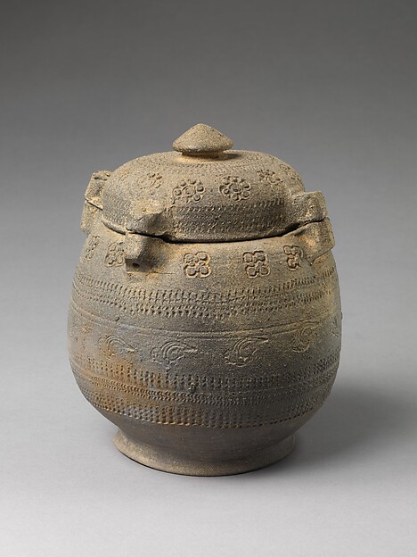 Covered urn with geometric decoration