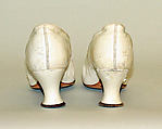 Wedding ensemble, Flaven (American), a) silk, wax
b,c) leather, metal, silk
d) wax, American