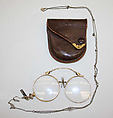 Eyeglasses, (a) gold, glass (b) metal, (c) leather, American