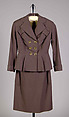 Suit, Elizabeth Arden  American, Wool<br/>a. Jacket: Hip-length; fitted with peplum; double-breasted; notch lapel; turn back cuffs; two angled mock pockets at bust<br/>b. Skirt: Knee-length; straight, American