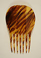 Comb, plastic (cellulose nitrate), American