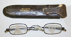 Spectacles, (a) steel, glass<br/>(b) leather, American or European