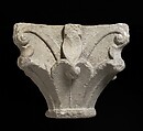 Capital, Stone; carved in relief; leaf forms and volutes.  Chipped., Catalan