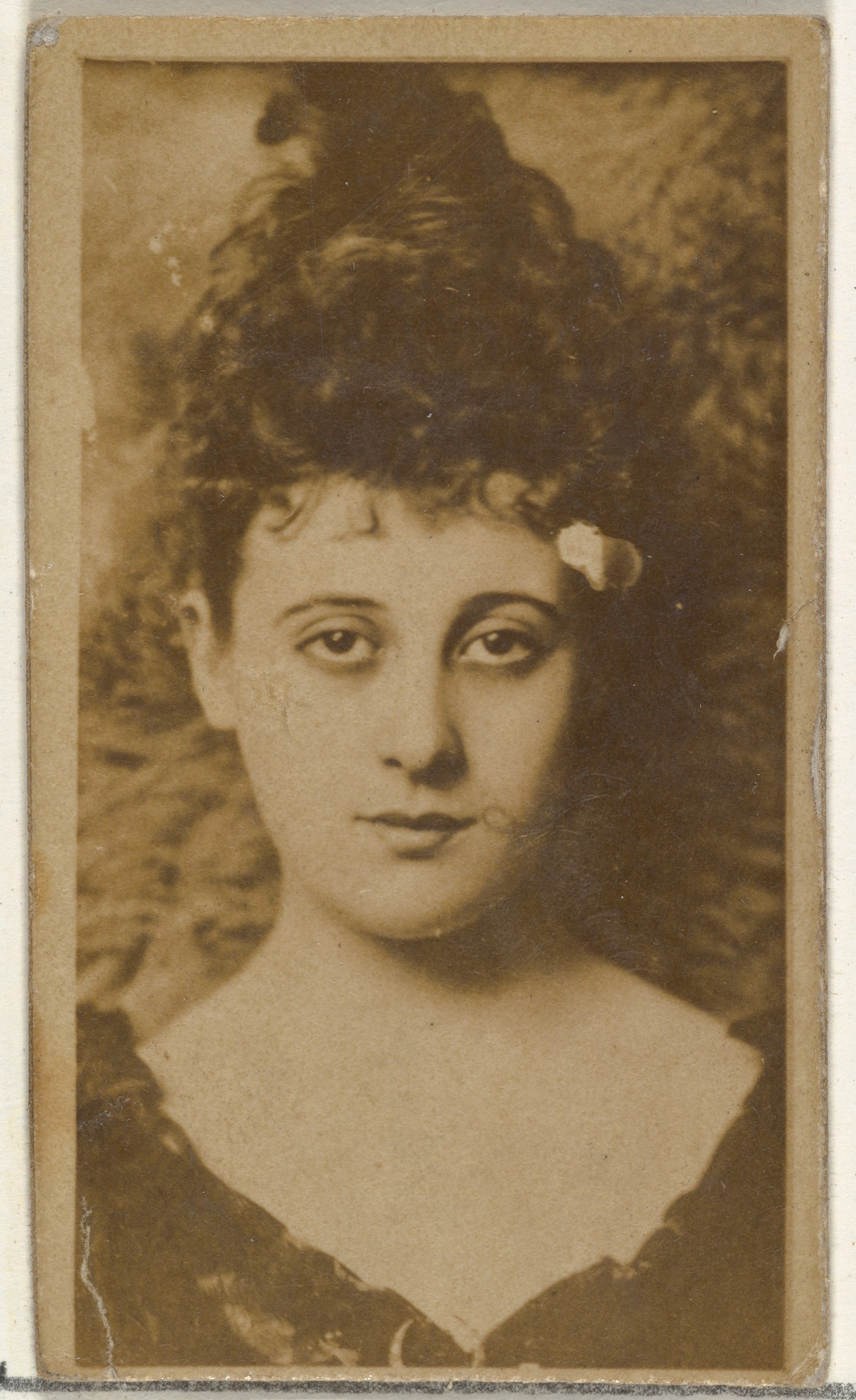 [Actress with dark hair piled on head], from the Actors and Actresses series (N145-8) issued by Duke Sons & Co. to promote Duke Cigarettes