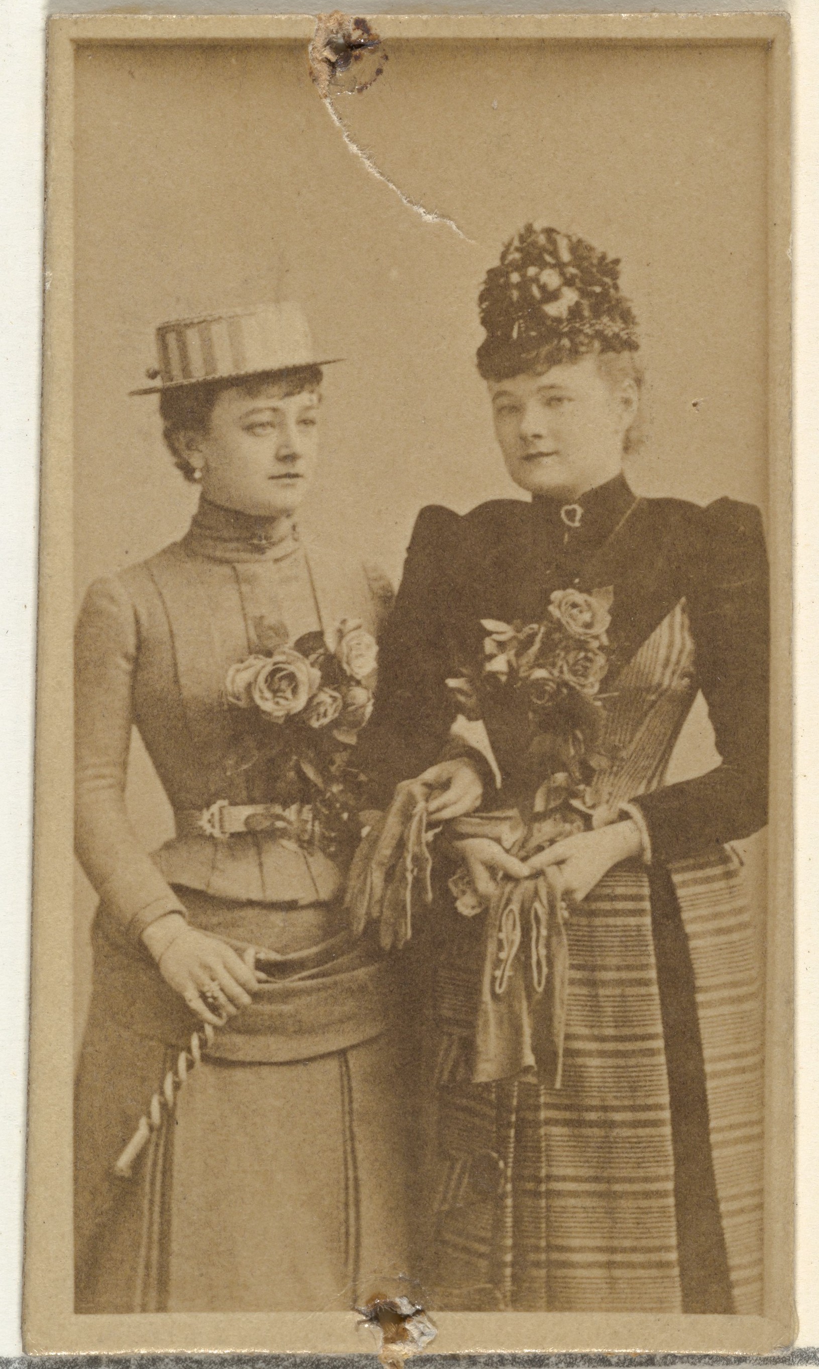 [Two actresses holding gloves], from the Actors and Actresses series (N145-8) issued by Duke Sons & Co. to promote Duke Cigarettes