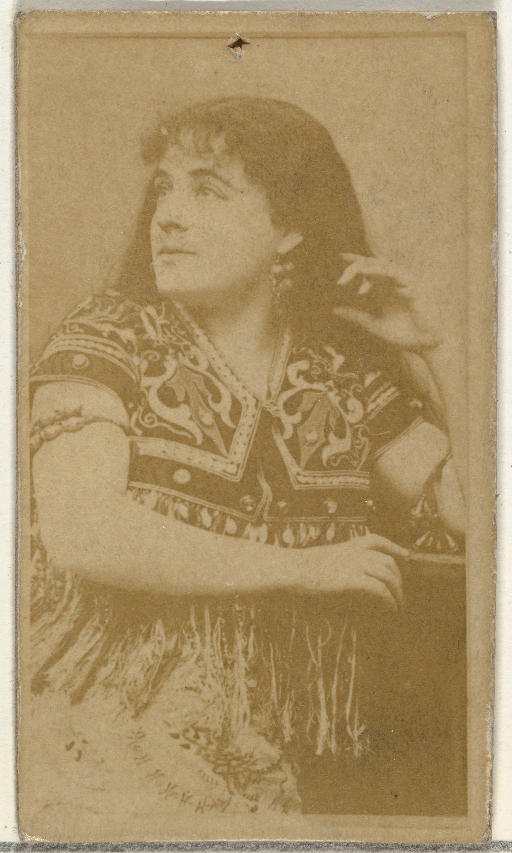 [Actress wearing patterned bodice], from the Actors and Actresses series (N145-8) issued by Duke Sons & Co. to promote Duke Cigarettes