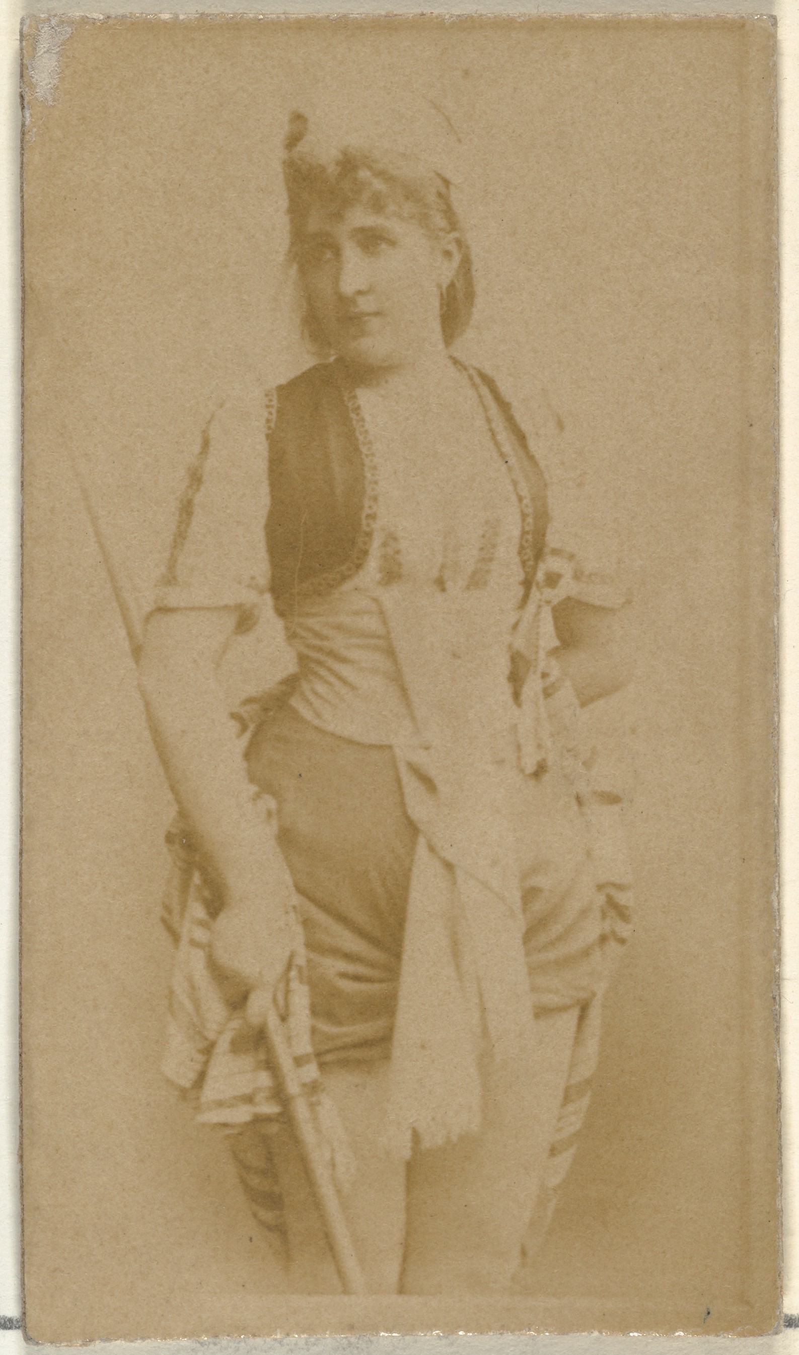 [Actress holding wooden cane], from the Actors and Actresses series (N145-8) issued by Duke Sons & Co. to promote Duke Cigarettes