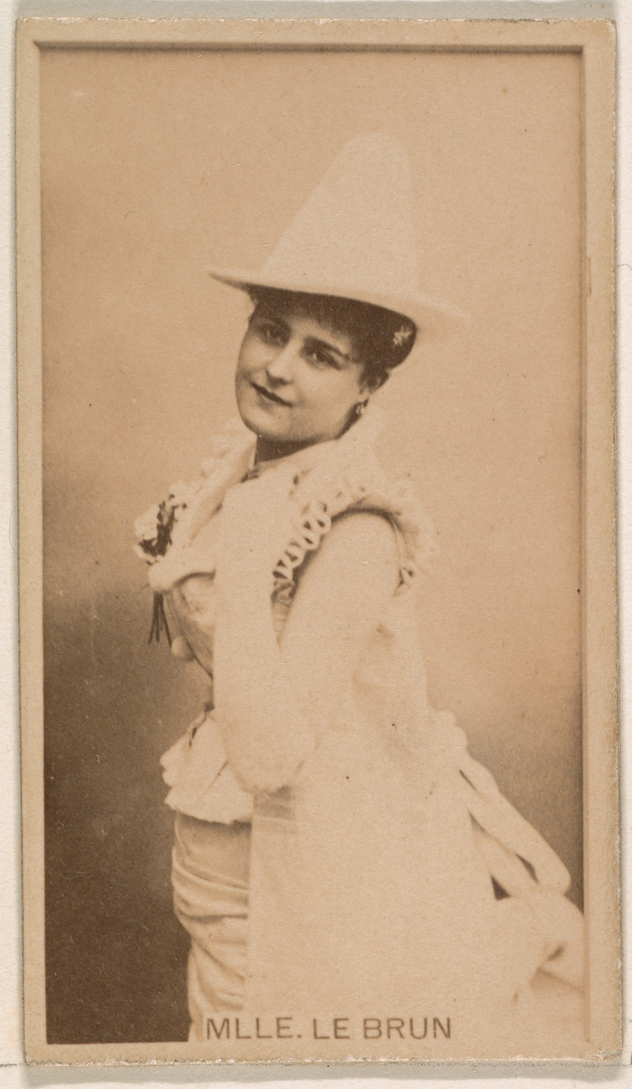 Mlle. Le Brun, from the Actresses series (N245) issued by Kinney Brothers to promote Sweet Caporal Cigarettes