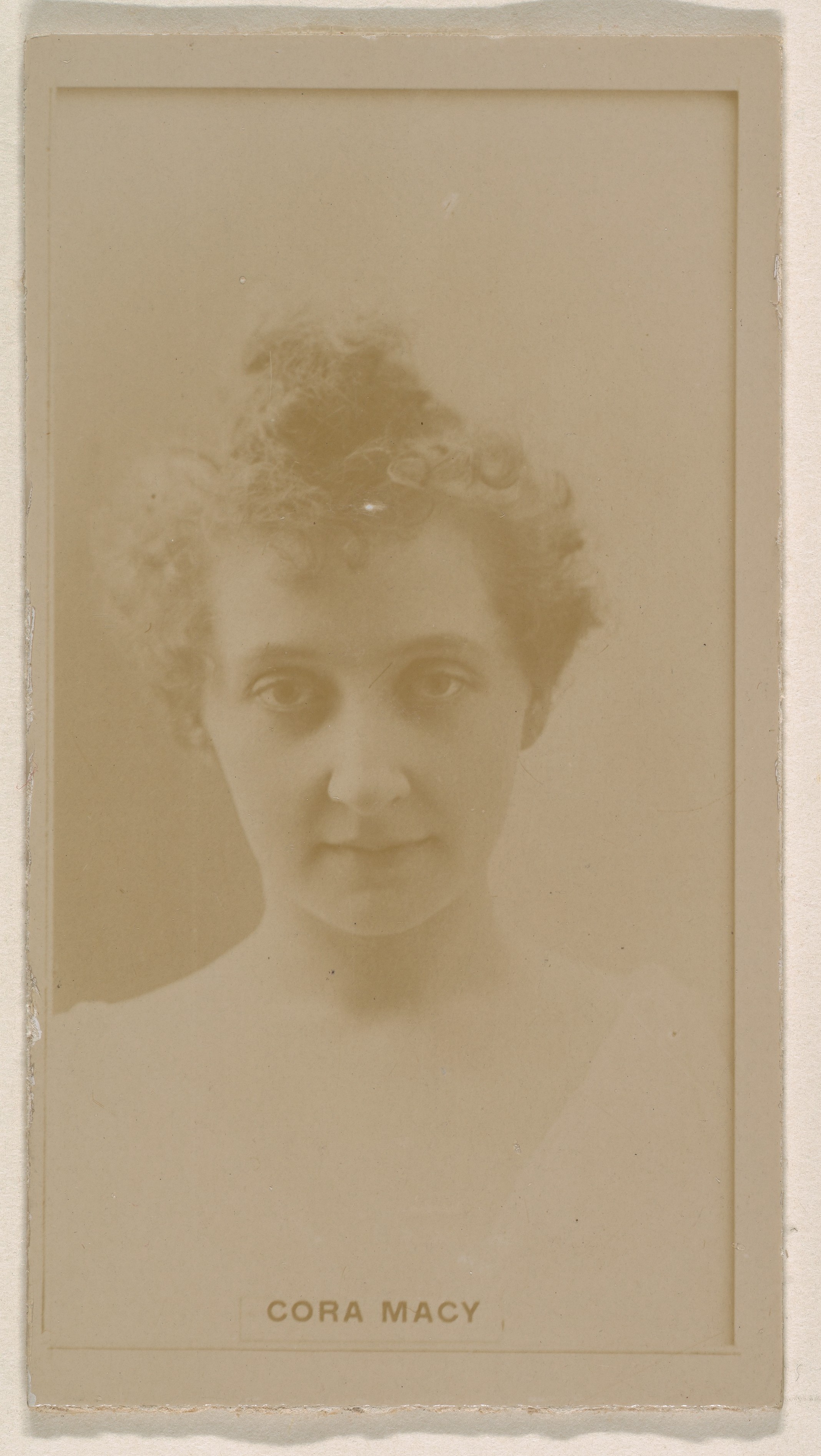 Cora Macy, from the Actresses series (N245) issued by Kinney Brothers to promote Sweet Caporal Cigarettes