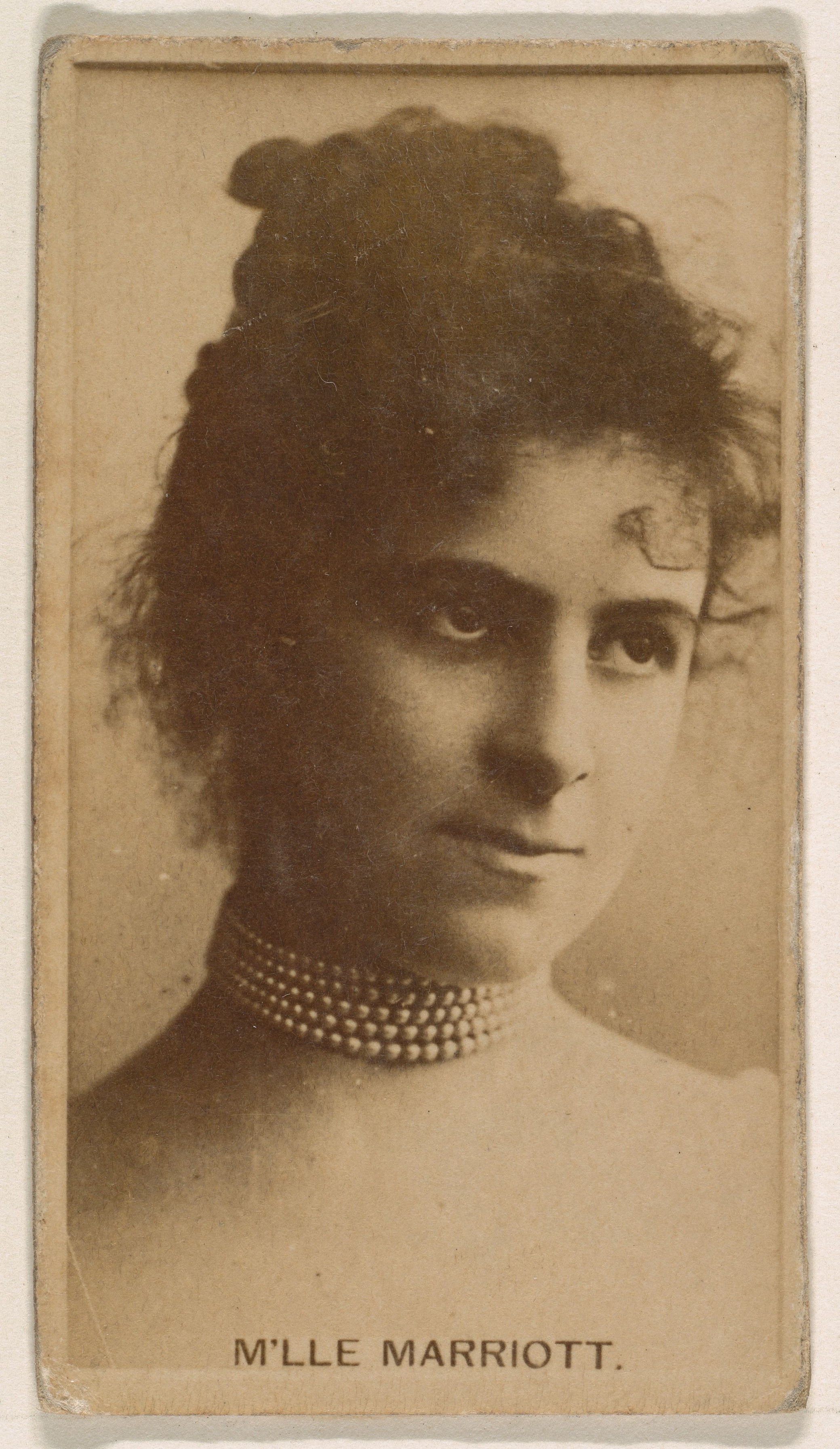 M'lle Marriott, from the Actresses series (N245) issued by Kinney Brothers to promote Sweet Caporal Cigarettes