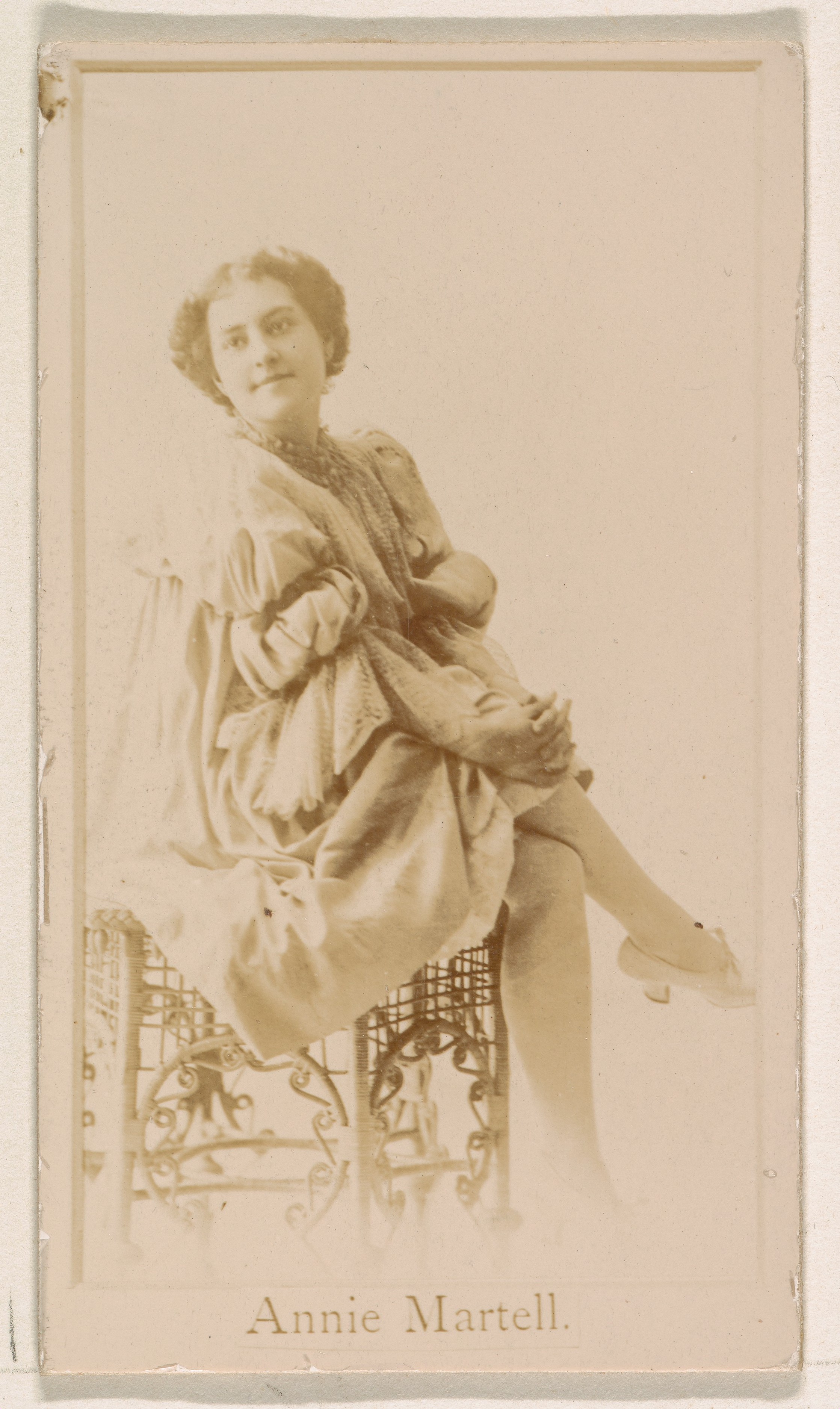 Issued by Kinney Brothers Tobacco Company, Annie Martell, from the Actresses  series (N245) issued by Kinney Brothers to promote Sweet Caporal Cigarettes