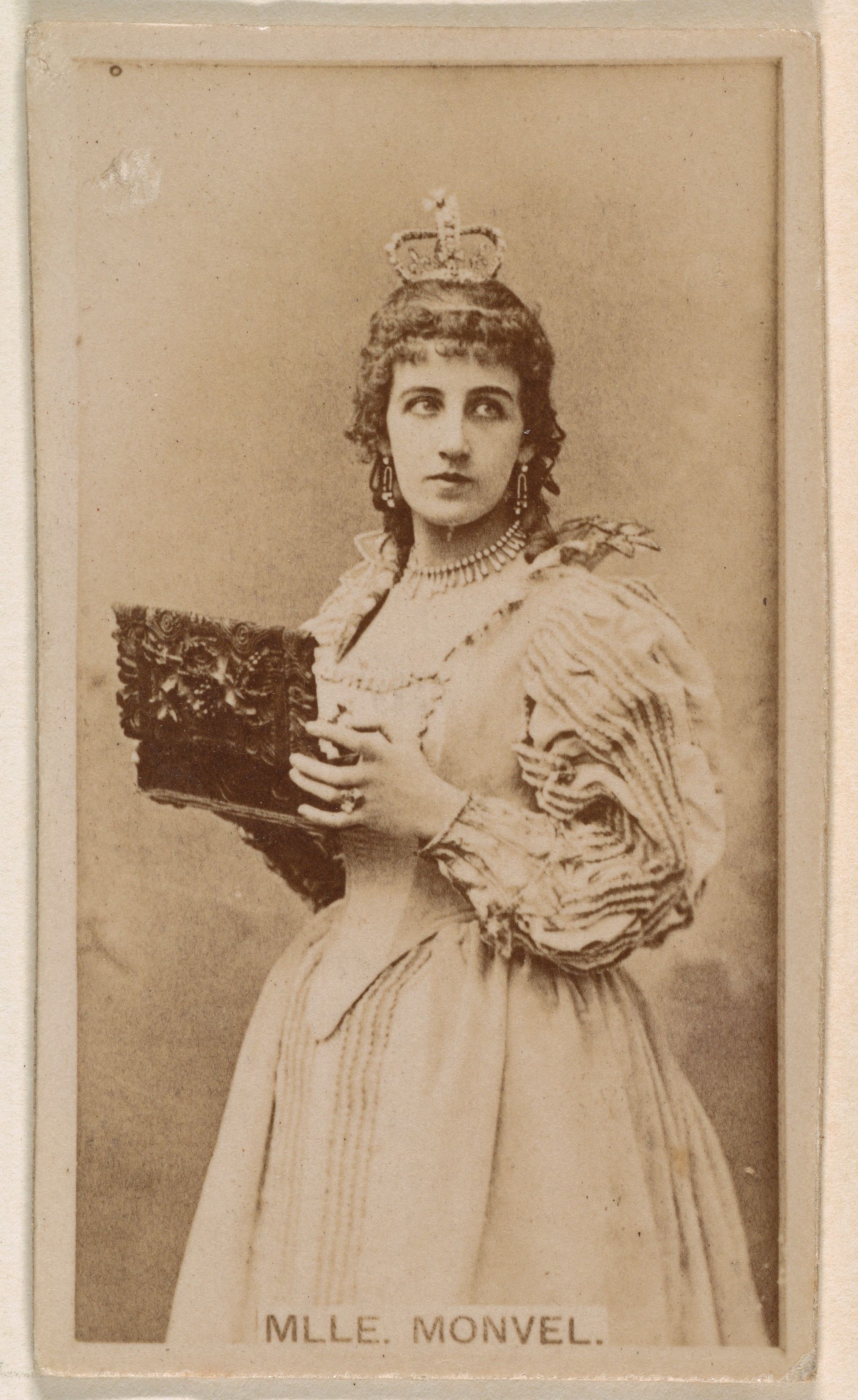 Mlle. Monvel, from the Actresses series (N245) issued by Kinney Brothers to promote Sweet Caporal Cigarettes