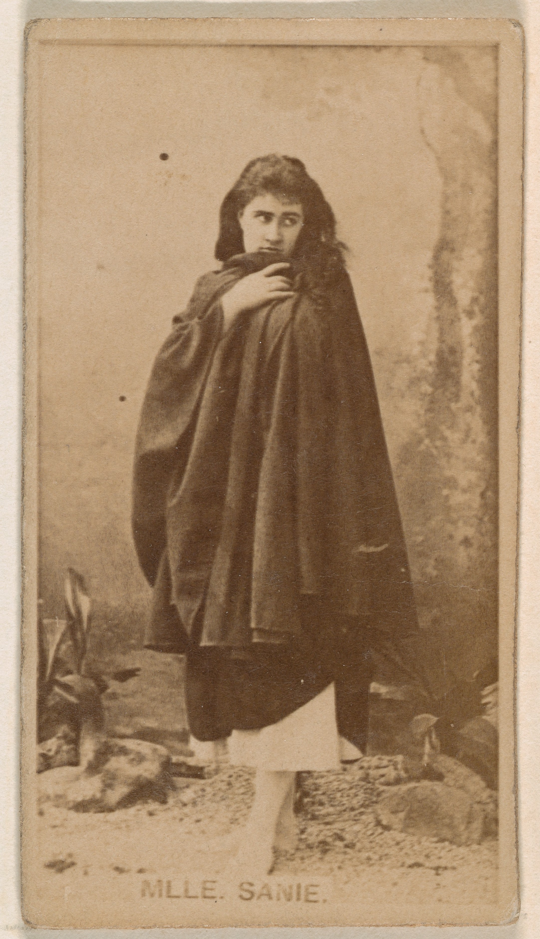 Mlle. Sanie, from the Actresses series (N245) issued by Kinney Brothers to promote Sweet Caporal Cigarettes