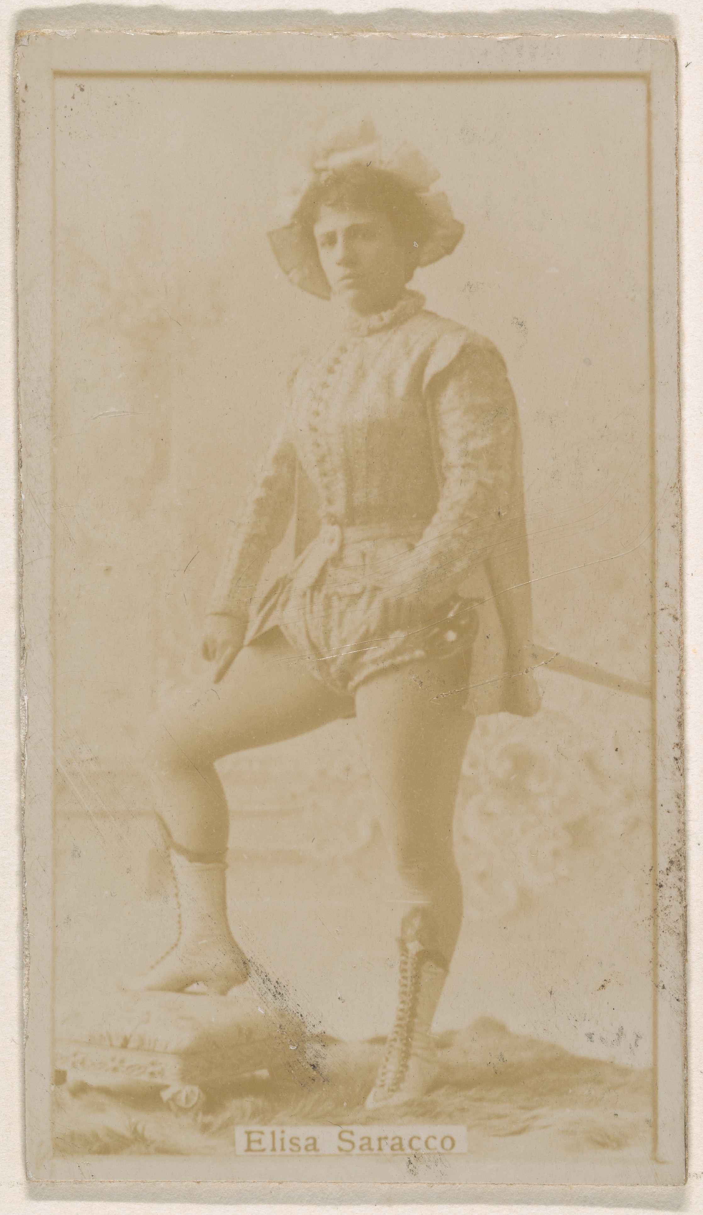 Mlle. Elisa Saracco, from the Actresses series (N245) issued by Kinney Brothers to promote Sweet Caporal Cigarettes