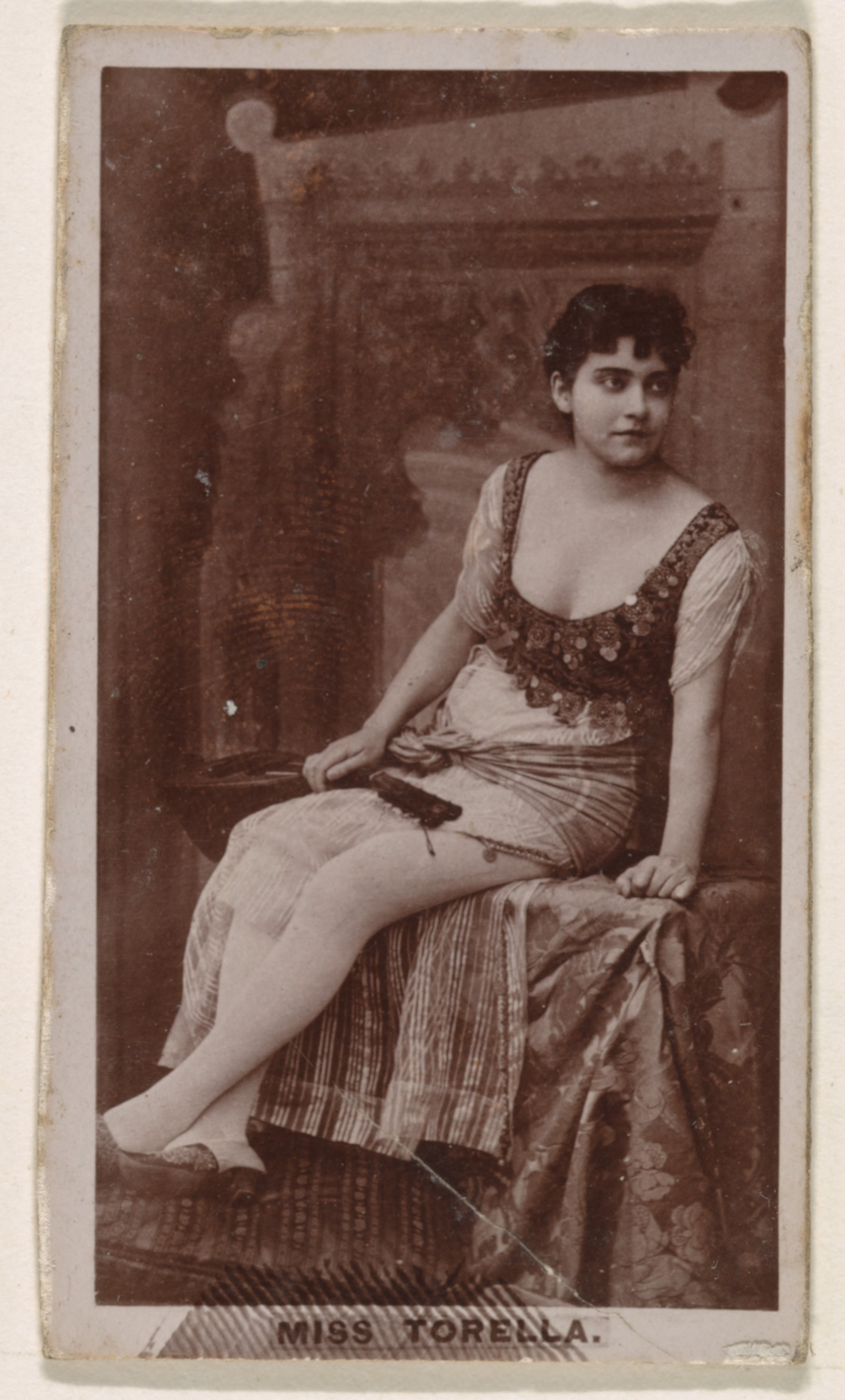Miss Torella, from the Actresses series (N245) issued by Kinney Brothers to promote Sweet Caporal Cigarettes