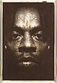 Man Spirit Mask, Willie Cole (American, born Newark, New Jersey, 1955), Left panel: Photo-etching, embossing, and hand coloring
Middle panel: Screenprint 
Right panel: Photo-etching and woodcut