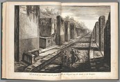 View from the street entering beneath the gateway to the city of Pompeii, with the foot paths and the shops, from "Antiquités de Pompeïa, tome premier, Antiquités de la Grande Grèce..." (Antiquities of Pompeii, volume one, Antiquities of Great Greece...), volume 1, plate 8, Francesco Piranesi  Italian, Etching