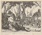 Saint John Preaching in the Desert (Saint Jean Préchant dans le Désert), with arm upraised, surrounded by male and female figures in a rocky setting, Jacques Callot French, Etching