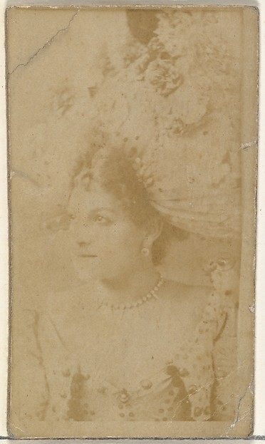 [Actress wearing ornate hat], from the Actors and Actresses series (N145-8) issued by Duke Sons & Co. to promote Duke Cigarettes