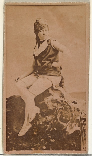 [Actress in studio posing on prop boulder], from the Actors and Actresses series (N145-8) issued by Duke Sons & Co. to promote Duke Cigarettes
