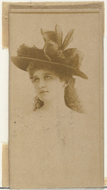 [Actress wearing hat with ornate ribbons], from the Actors and Actresses series (N145-8) issued by Duke Sons & Co. to promote Duke Cigarettes