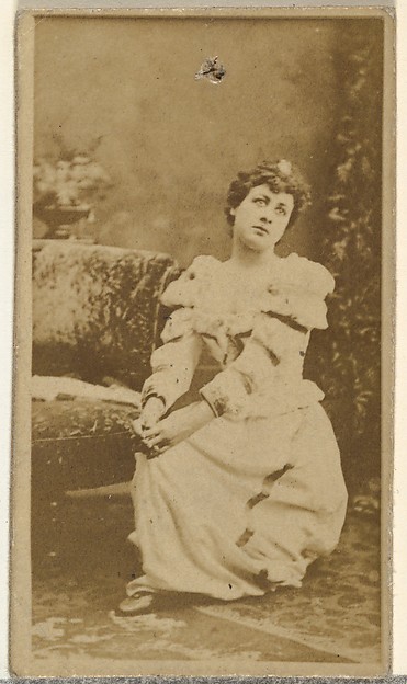 [Seated actress wearing dress with ruffled sleeves], from the Actors and Actresses series (N145-8) issued by Duke Sons & Co. to promote Duke Cigarettes