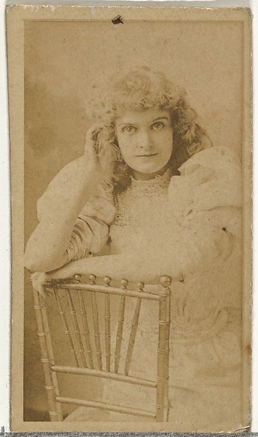 [Actress posing on chair], from the Actors and Actresses series (N145-8) issued by Duke Sons & Co. to promote Duke Cigarettes