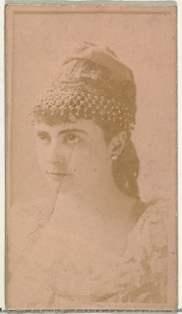 [Actress wearing ornate cap], from the Actors and Actresses series (N145-8) issued by Duke Sons & Co. to promote Duke Cigarettes